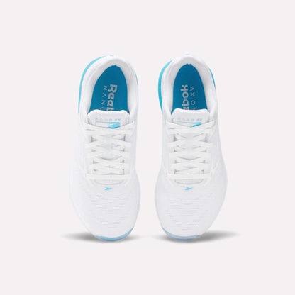 Top view of Reebok Women's Nano X5 Training Shoes in white, with blue insoles and soles, white laces, and subtle blue accents. Shoes are placed side by side on a light background.