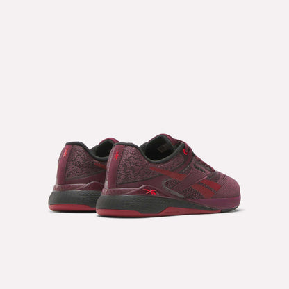 The Reebok Women's Nano X5 Training Shoes in maroon with black and red accents are designed for comfort, shown from the back and side against a plain white background.