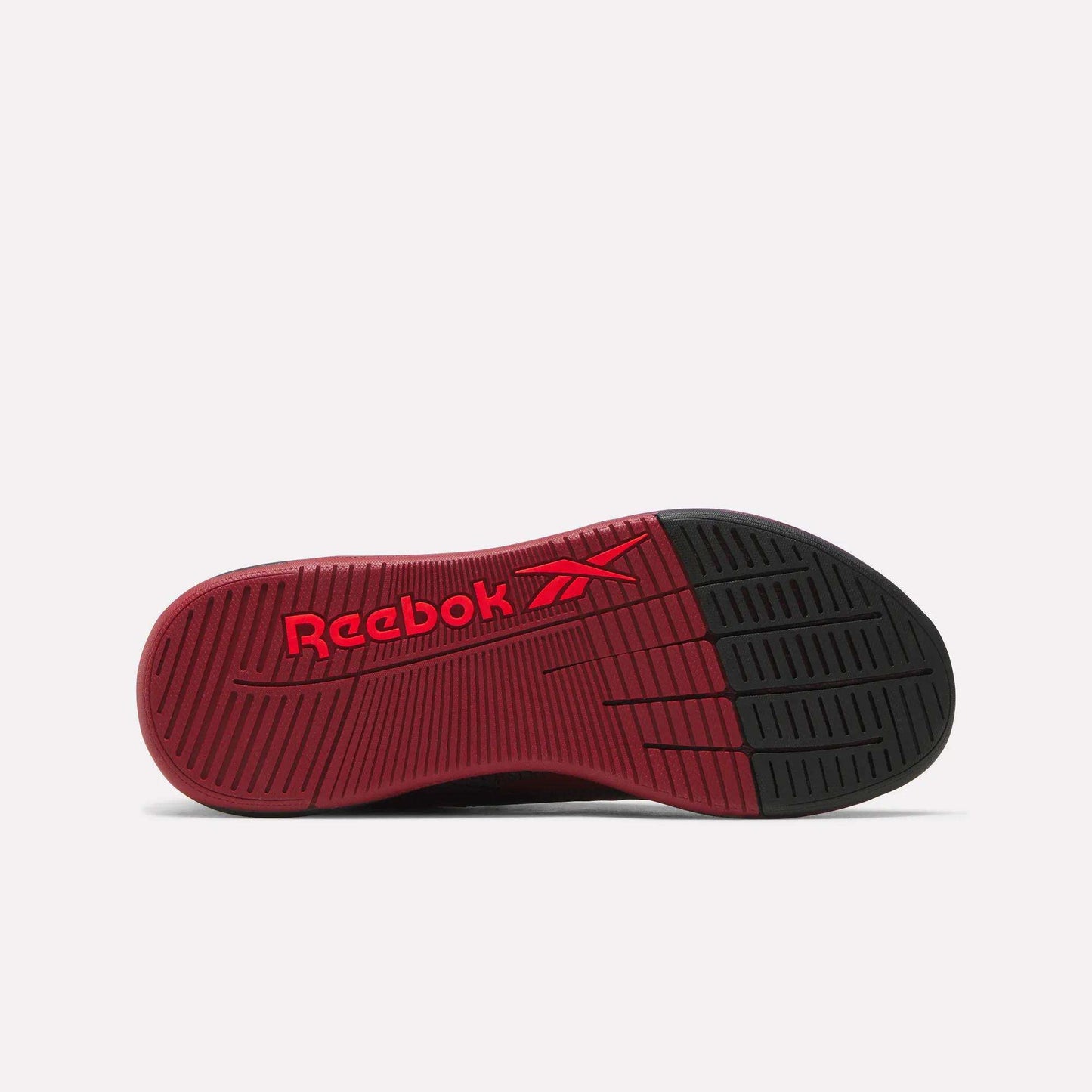 The Reebok Women's Nano X5 Training Shoes feature a mostly red sole with a black toe, highlighted by the red Reebok logo. The ribbed, textured tread provides excellent grip and support for every workout.