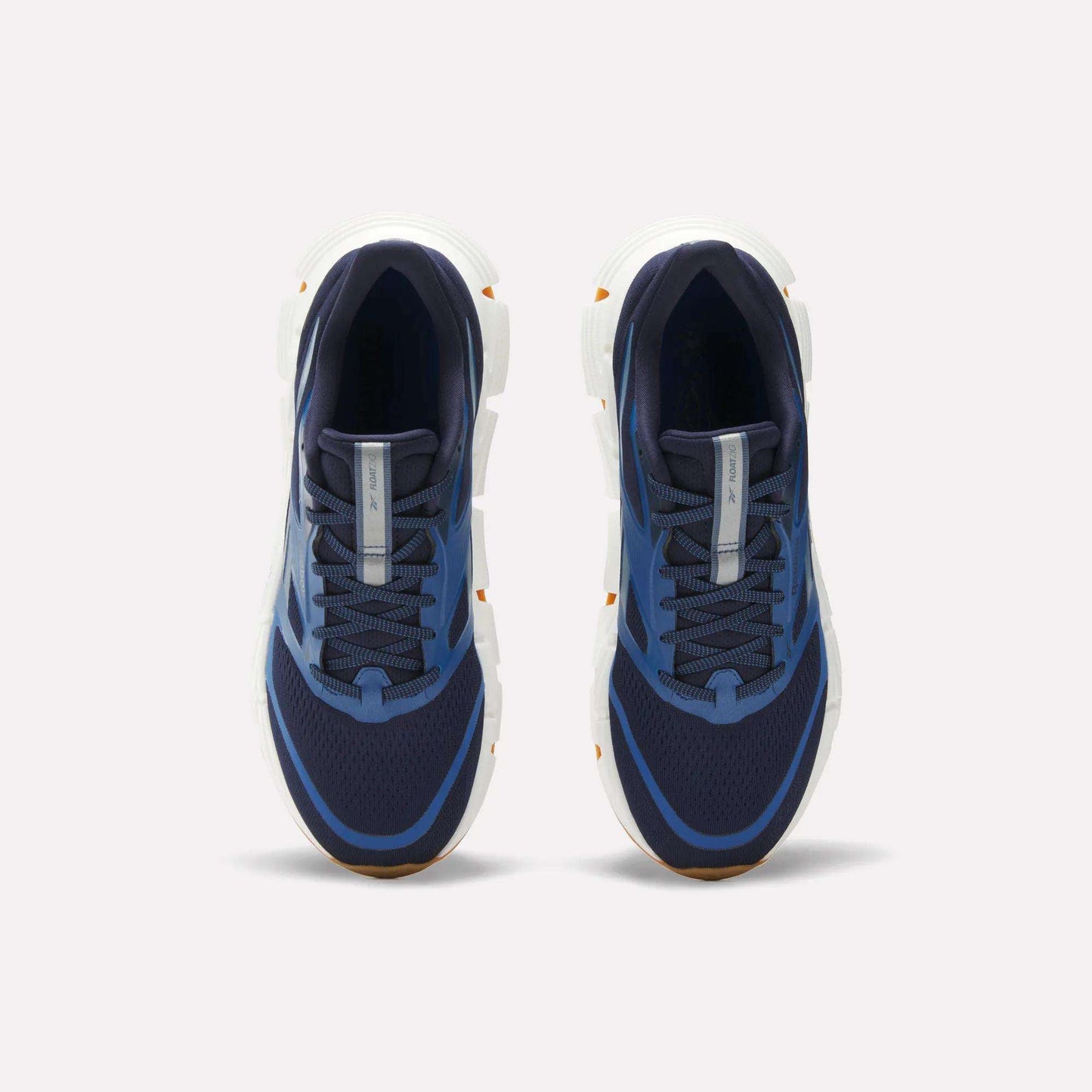 Reebok Men's FloatZig 2 Running Shoes in navy blue with white soles, mesh uppers, and light blue accents. Features Superfloat+ cushioning. Shown from a top-down view on a plain white background.