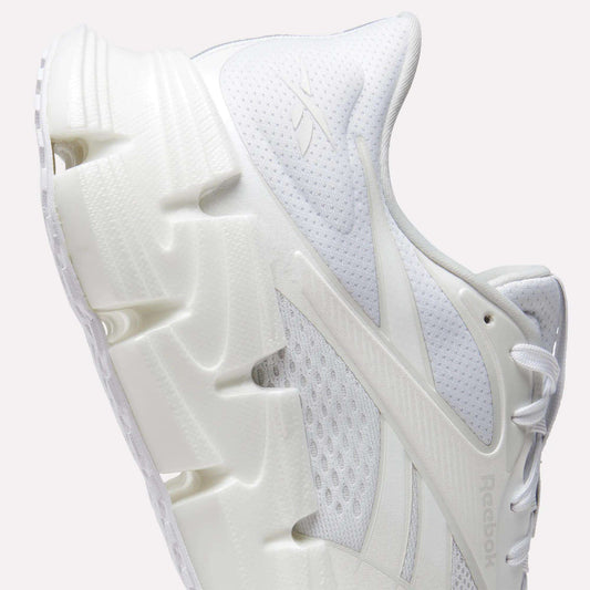 A close-up side view of the Reebok Men's FloatZig 2 Running Shoes, featuring a chunky sculpted sole, mesh upper, energy-returning cushioning, intricate panel details, and the iconic Reebok logo—ideal for running enthusiasts.