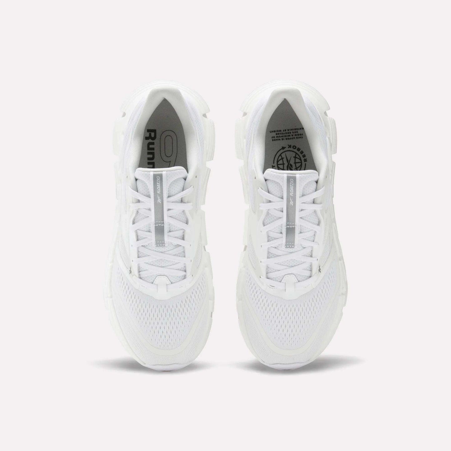 A pair of Men's FloatZig 2 Running Shoes by Reebok, seen from above on a light background, with white mesh uppers, laces, branded insoles, and energy-returning cushioning.