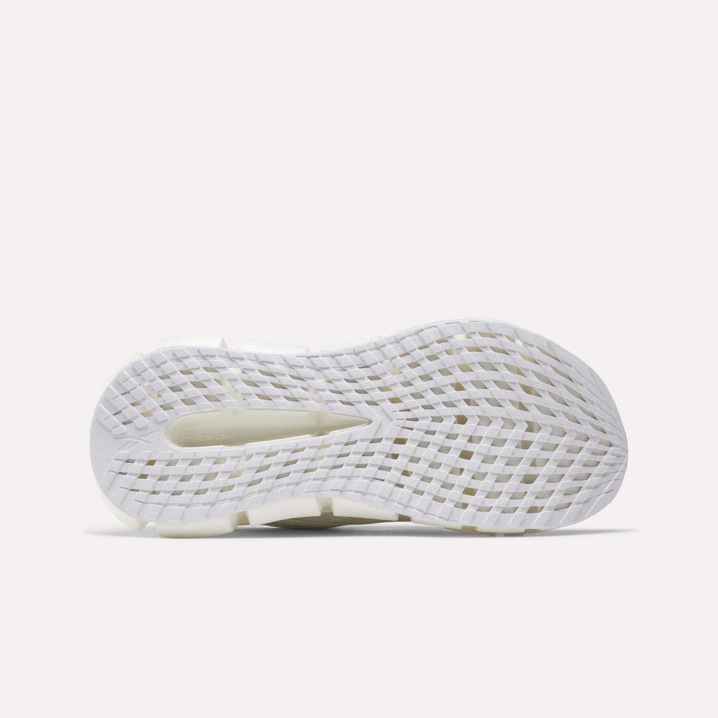 The image displays the white, textured sole of Reebok Women's FloatZig 2 Running Shoes. It features a grid-like traction pattern, a heel cutout, and Superfloat+ cushioning against a plain light background.
