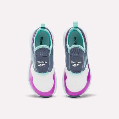 Top view of Kids' Nano Play Slip-on by Reebok—these kid-sized sneakers feature white mesh uppers with turquoise, purple, and navy accents plus light blue heel tabs.