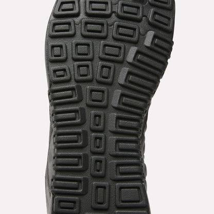 Close-up of the Reebok Nano 2.0 Training Shoes’ black sole, featuring a textured pattern of raised squares and rectangles for superior traction and grip—ideal for peak performance.