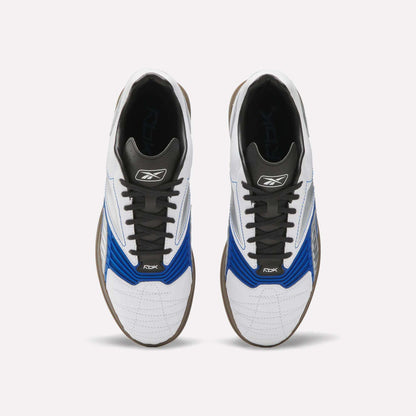 A pair of Reebok Hammer Valde Shoes seen from above, with a white leather upper, blue and black accents, black laces, brown soles, and branding on the tongue and side.