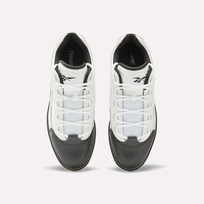 Top view of a pair of Reebok Question Golf Shoes in white and black, showcasing a premium design with white laces, black toe caps, and mesh detailing on the upper.