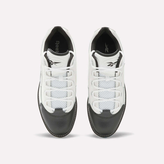Top view of a pair of Reebok Question Golf Shoes in white and black, showcasing a premium design with white laces, black toe caps, and mesh detailing on the upper.