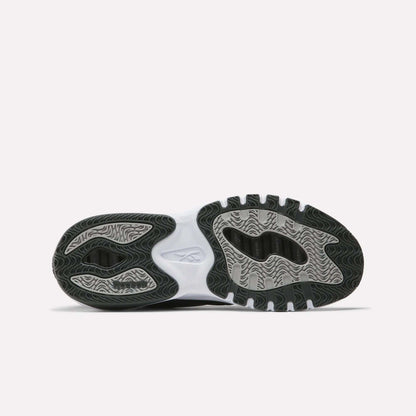The image shows the outsole of Men’s ERS Training Shoes by Reebok, featuring a wavy, textured black and gray tread, premium cushioning, a white midsection, and the Reebok logo at the center on a plain white background.