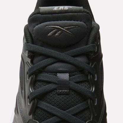Close-up of Reebok Men's ERS Training Shoes in black, featuring laces, mesh fabric, sleek overlays, padded tongue with Reebok logo, visible stitching, and premium cushioning for comfort.