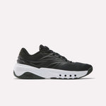 The Reebok Men's ERS Training Shoes in black feature premium cushioning and a thick white sole with circular cut-outs, displayed in a side view on a plain white background.