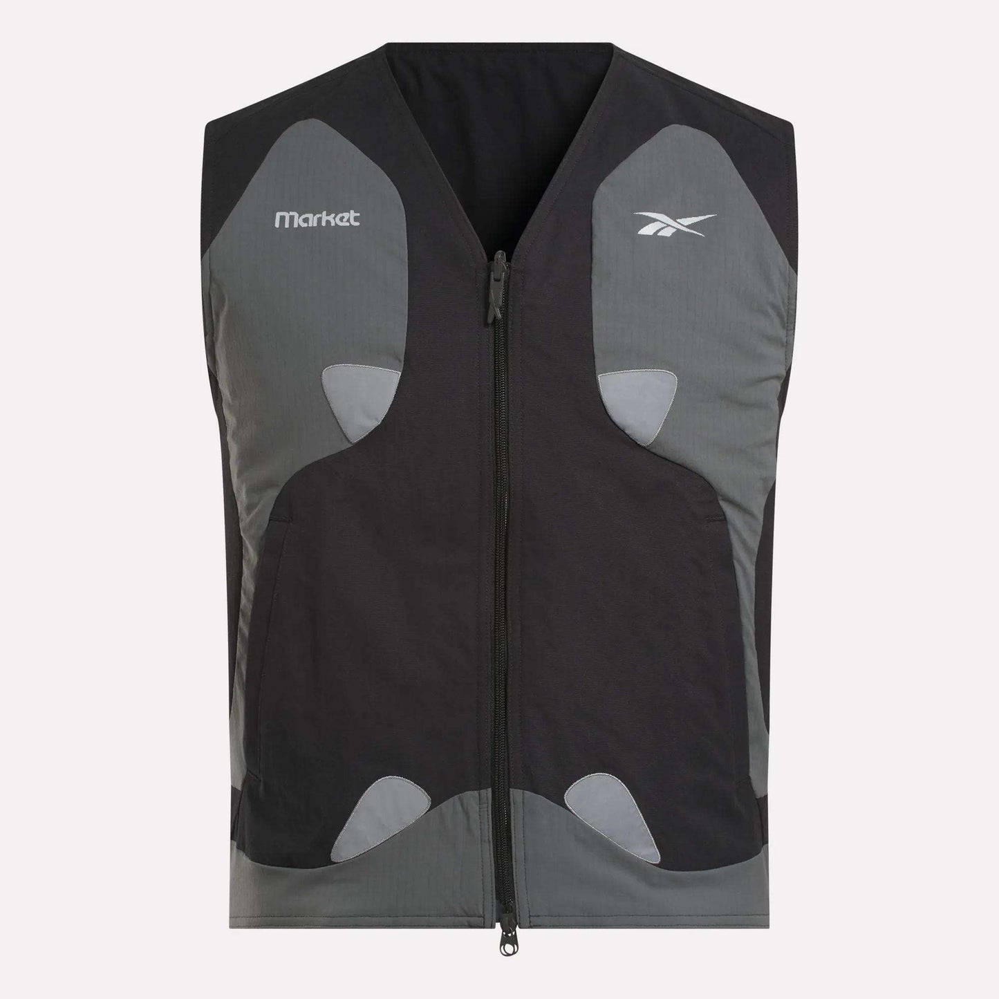 The Reebok x MARKET Reversible Vest is a black and gray streetwear sleeveless vest with a front zipper, chest logos from Reebok and Market, and light gray accent patches on the front.