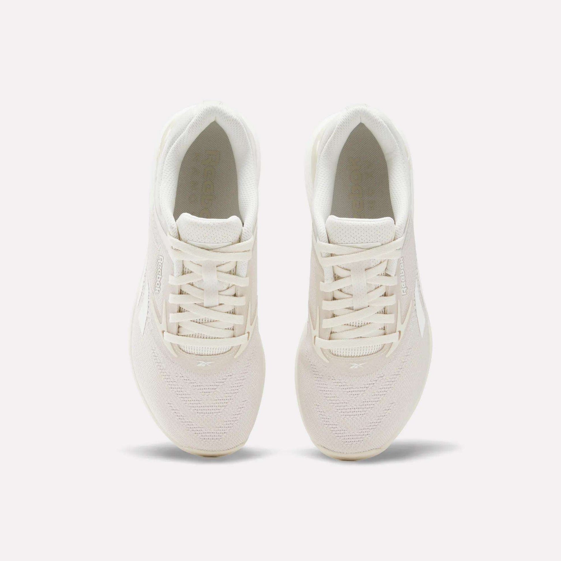 The Reebok Women's Nano X5 Training Shoes are a stylish white option designed for women's everyday workouts and casual wear.