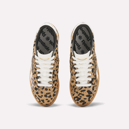 A pair of Reebok Women's Club C Grounds UK Shoes with a tan and black leopard print, white laces, and black Reebok insoles is seen from above on a plain white background.