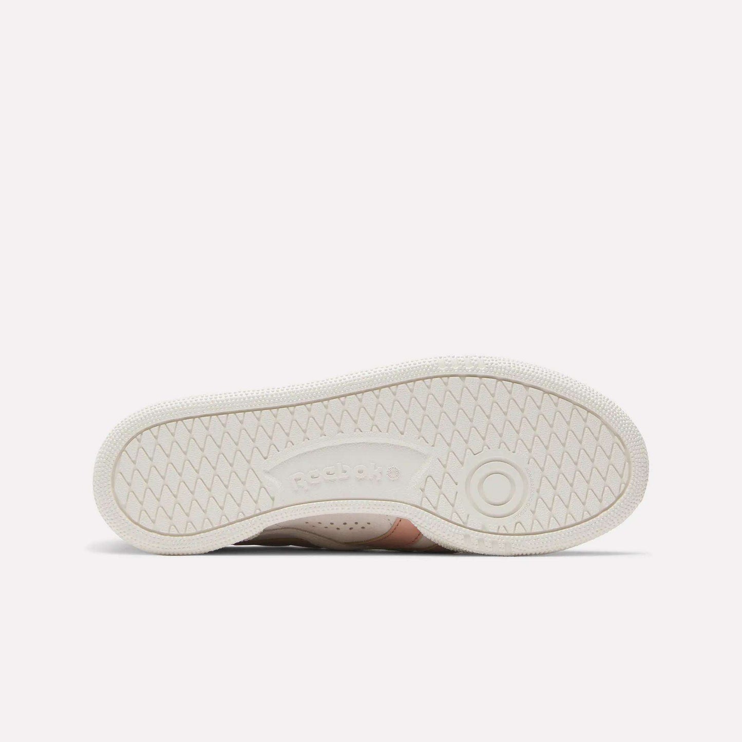 Women's Club C Grounds UK Shoes by Reebok shown with the sole facing up, featuring a textured herringbone tread and embossed Reebok logo—sport-inspired style ideal for casual outfits.