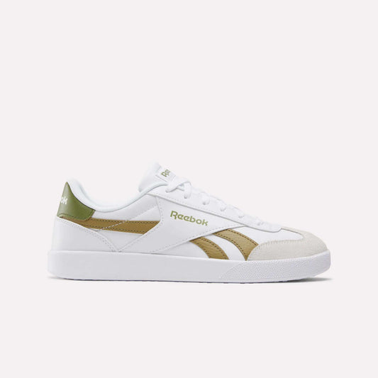 The Smash Edge Shoes are white Reebok sneakers with green and gold accents, featuring a suede T-toe, side logo, white laces, and a flat white sole—classic indoor soccer-inspired style shown on a plain light background.
