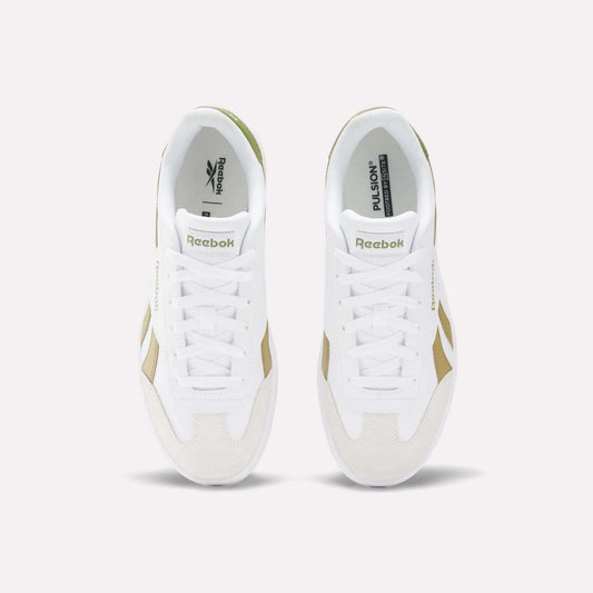Two white Reebok Smash Edge Shoes with beige and olive green accents are side by side, viewed from above to display the tops, laces, Reebok branding on the tongue and insole, and a classic suede T-toe inspired by indoor soccer style.