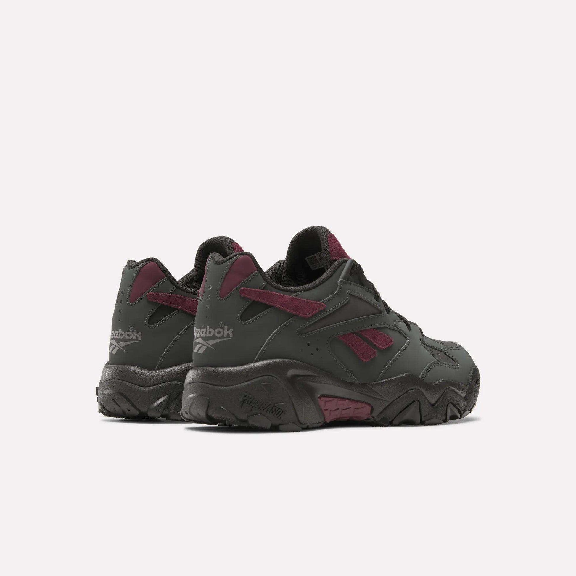 A pair of Preseason 94 Low Retro Basketball Shoes by Reebok in dark gray with maroon accents and the classic logo, shown on a plain white background.