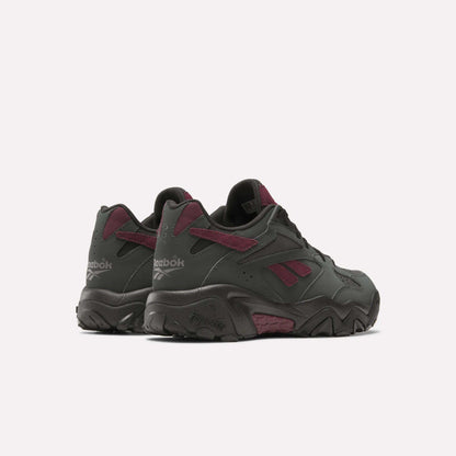 A pair of Preseason 94 Low Retro Basketball Shoes by Reebok in dark gray with maroon accents and the classic logo, shown on a plain white background.