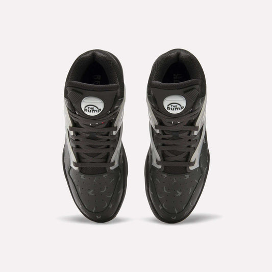 Top view of Reebok Pump Omni Zone II Retro Basketball Shoes with black uppers, white and reflective accents, dark gray laces, and white circular Pump patches on the tongues. The textured surface features small perforations.