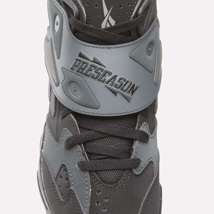 A close-up of the black and gray Reebok Preseason 94 Retro Basketball Shoes, featuring a PRESEASON strap that channels ‘90s design for standout training style.