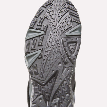 Close-up of the sole on Reebok Preseason 94 Retro Basketball Shoes, highlighting its detailed, textured tread pattern with geometric shapes and grooves designed for traction.