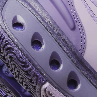Close-up of Reebok Engine A Basketball Shoes in purple/lavender, showcasing textured and smooth surfaces, detailed stitching, three oval ventilation holes, and advanced SuperFloat foam for superior comfort.