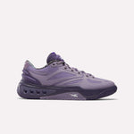 The Reebok Engine A Basketball Shoes feature a purple low-profile design with wavy panels, vented midsoles, and SuperFloat foam for cushioned comfort, displayed on a plain white background.
