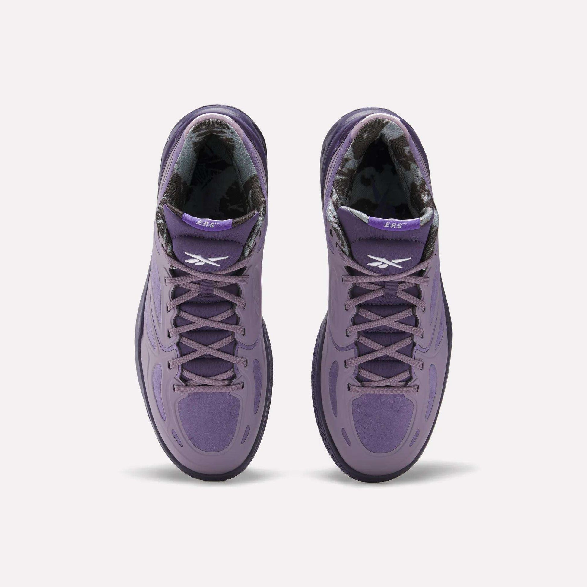 Top view of Reebok Engine A Basketball Shoes in purple with black and white patterned inner lining, white Reebok logos on the tongues, and advanced ERS technology, set against a plain white background.