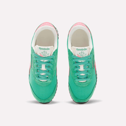 A top view of Reebok Women's Classic AZ Shoes in green, featuring white tongues, black soles, and pink accents on the sides and heels—an ideal pick for retro running shoe fans, displayed against a plain white background.