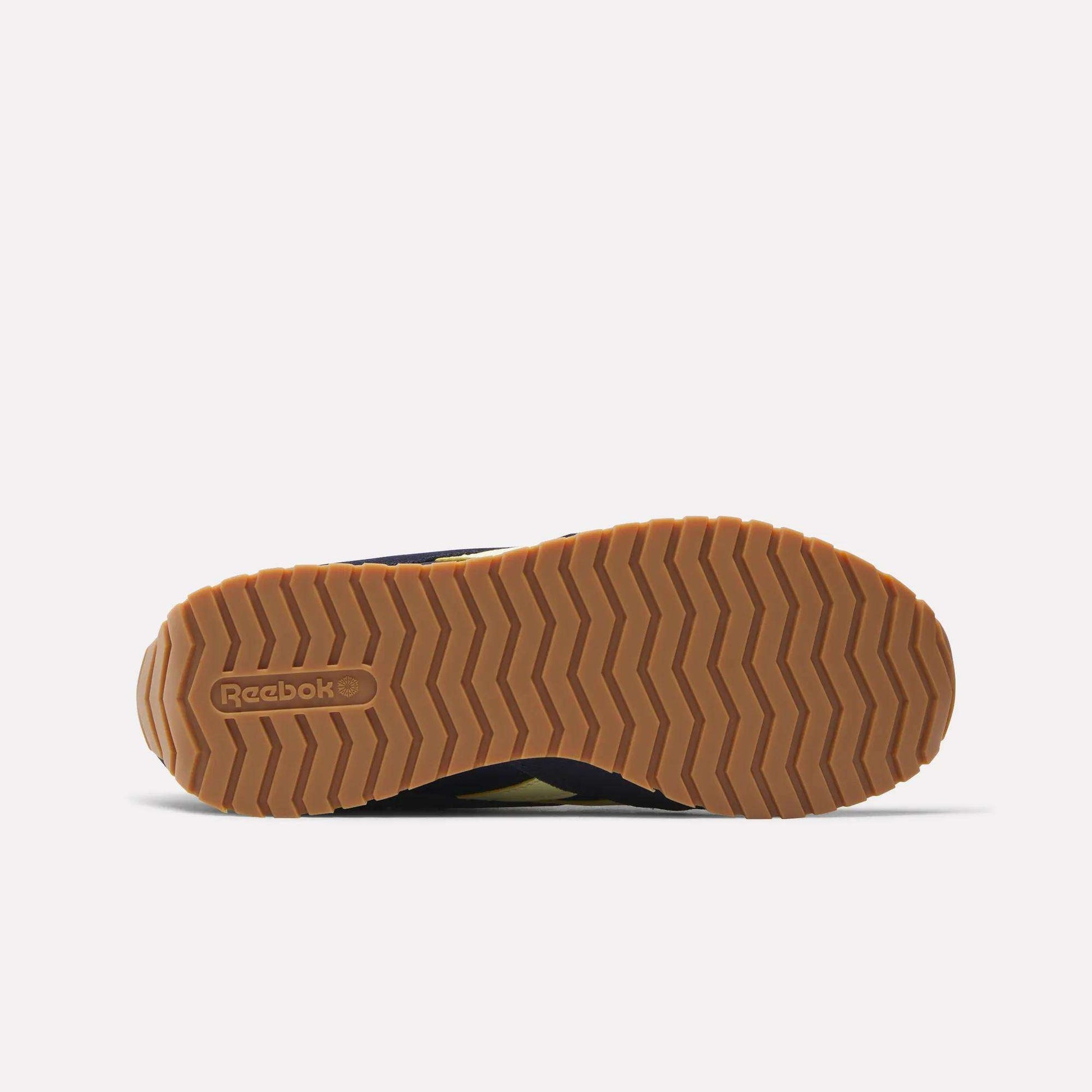 A close-up of the Women's Classic AZ Shoes by Reebok, showcasing their timeless design and retro-inspired details.