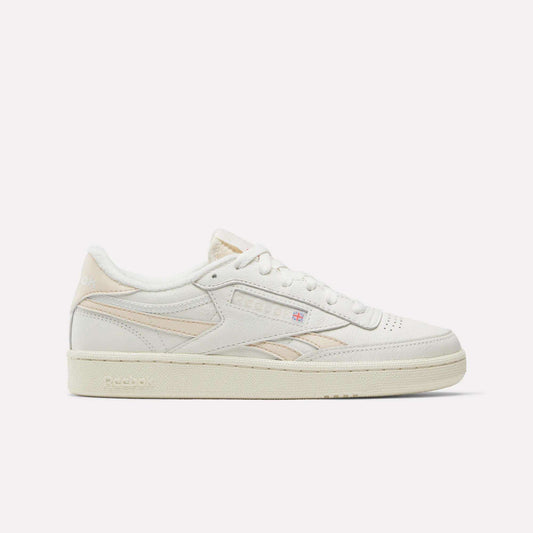 The Reebok Women's Club C Revenge Vintage Shoes feature a white upper with beige accents, lace-up design, and Reebok logos on the side and heel—ideal for women’s collections. Shown from the side against a plain white background.