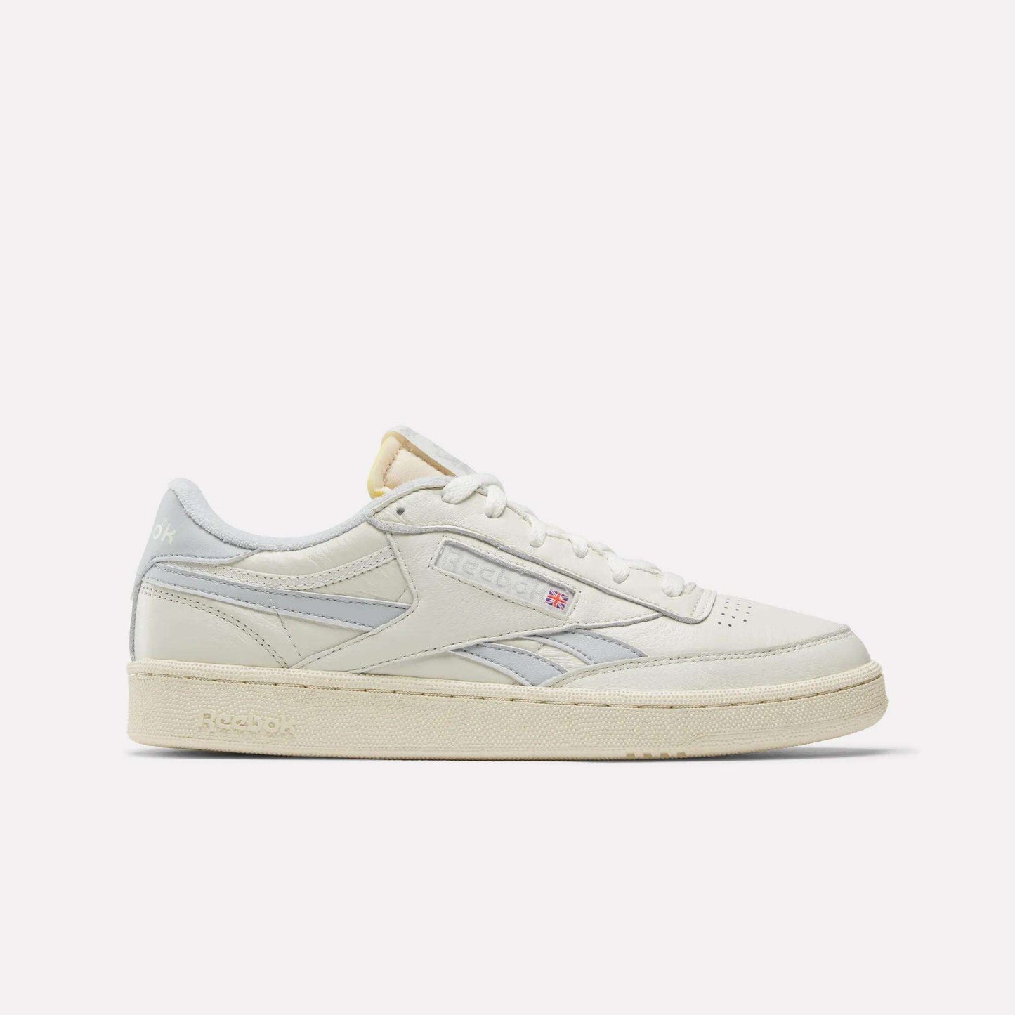 Side view of Reebok Club C Revenge Vintage Shoes in white full-grain leather with light gray accents, cream-colored sole, and subtle side branding, displayed against a plain white background.