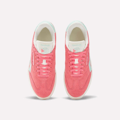 Top view of a pair of Reebok Campio Extra Women's Shoes in pink with white platform midsoles, pale blue accents, and white interior lining, displayed side by side on a plain light background.