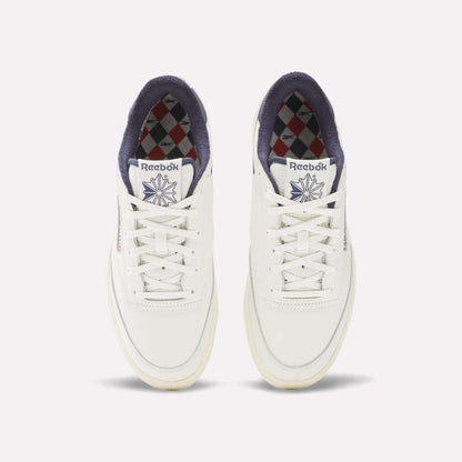 The Reebok Men's Club C Golf Shoes are white, made from water-resistant leather, and feature a spikeless outsole for all-day comfort on and off the course.