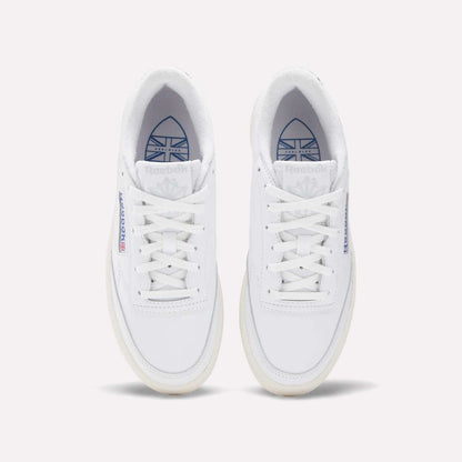 Top view of Reebok Women's Club C Golf Shoes in water-resistant leather, featuring white sneakers with blue and red branding on the tongue and side, displayed side by side on a plain white background.