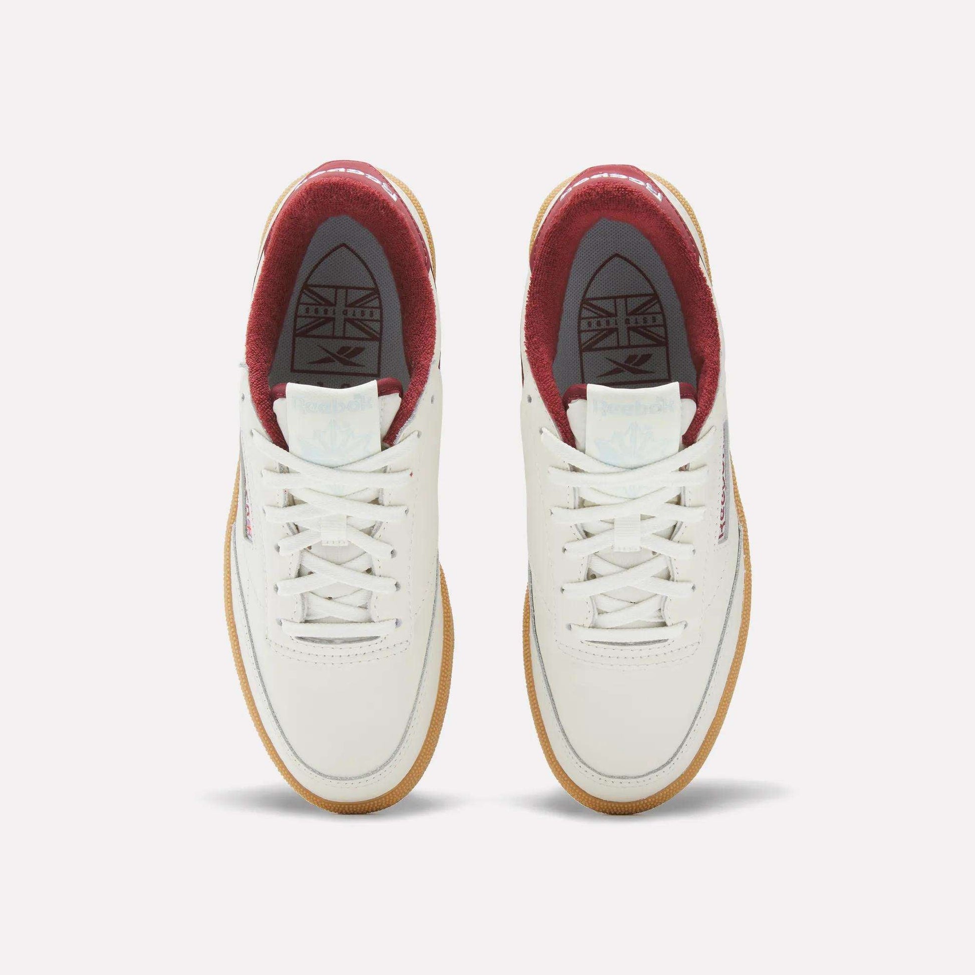 The Women's Club C Golf Shoes by Reebok are white, water-resistant leather golf shoes with a sleek spikeless outsole for comfort on and off the course.