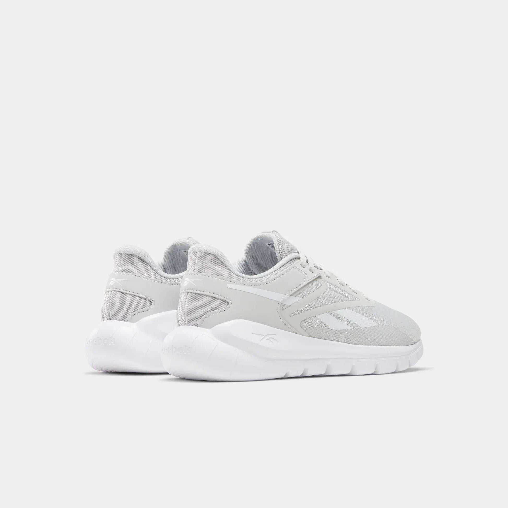 Men's Split Flex Training Shoes by Reebok, in light gray with white soles, are shown from the back and side on a white background. Their mesh and synthetic build is perfect for HIIT classes, with the Reebok logo clearly visible.