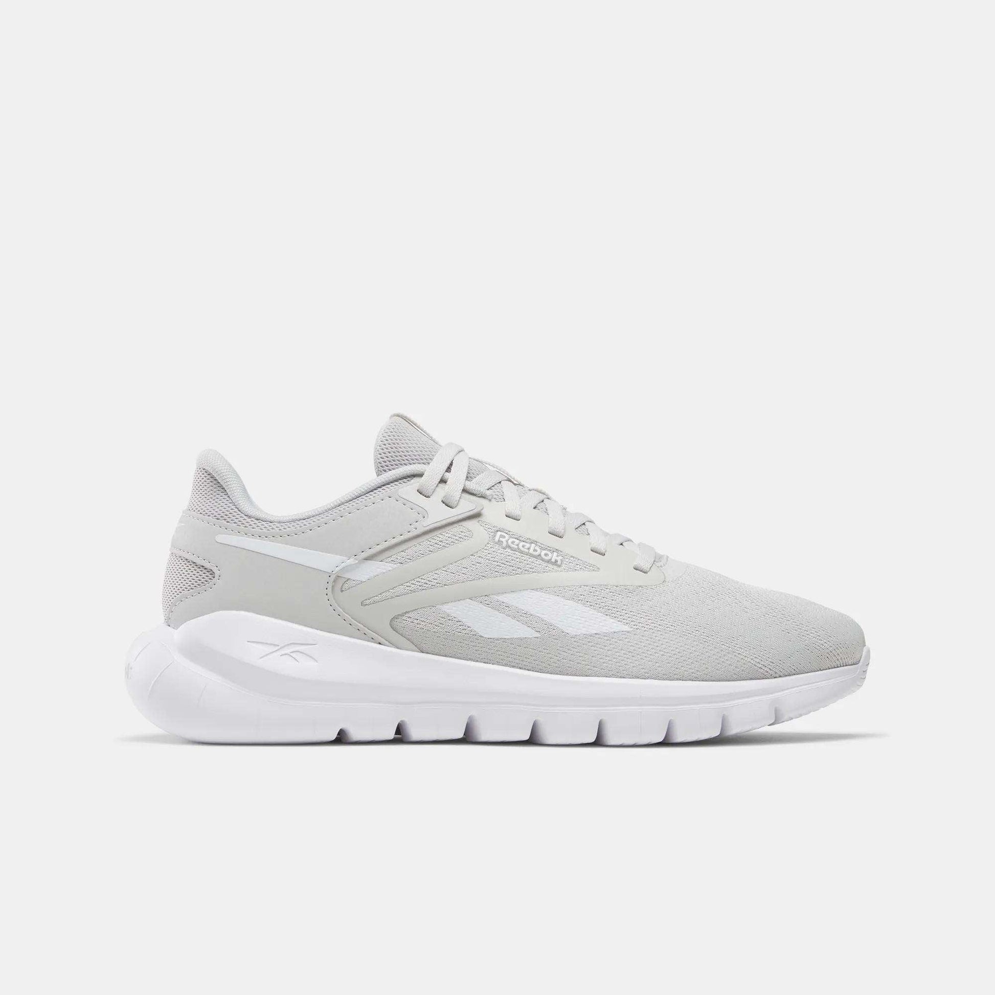 The Reebok Men's Split Flex Training Shoes in light gray with white accents and logo feature a white cushioned sole, shown in side profile on a white background—perfect for HIIT classes or daily workouts.