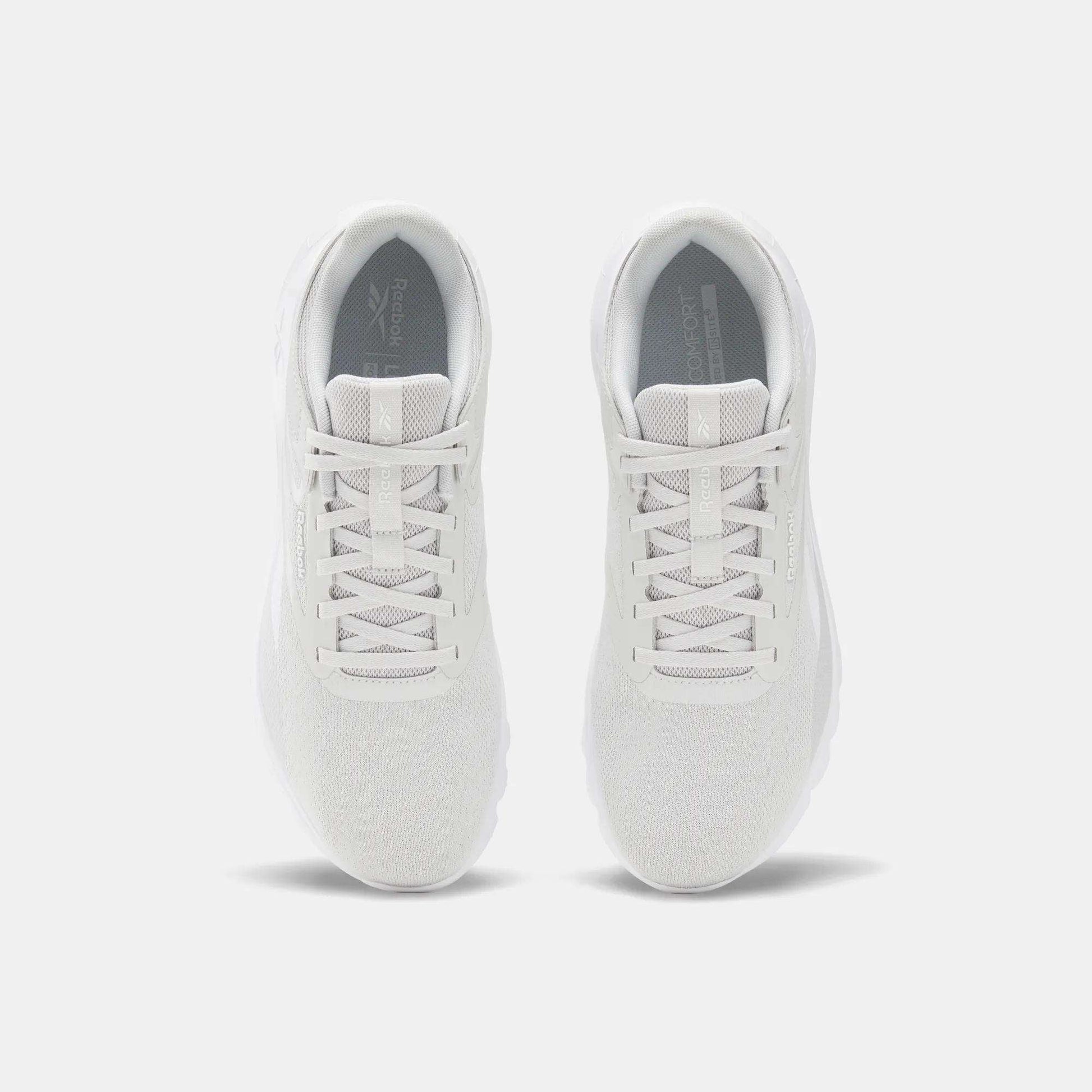 Top view of Reebok Men's Split Flex Training Shoes in white with mesh uppers and white laces, placed side by side on a light gray background—ideal for HIIT sessions or everyday workouts.