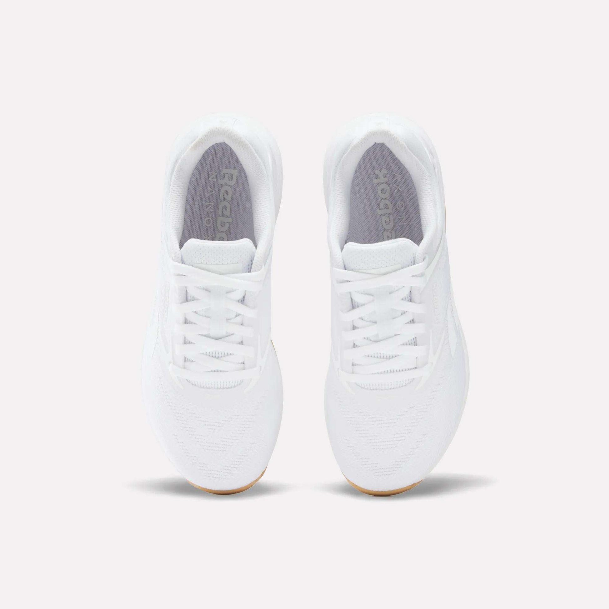 A pair of Women's Nano X5 Training Shoes by Reebok, shown from above with visible laces, toe area, and logo on the insoles, displayed against a plain light background.