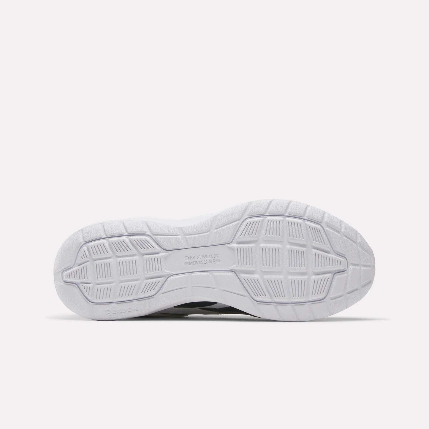 The image shows the white outsole of the Reebok Men's Walk Ultra 7 DMX Max Wide 4E Shoes, featuring a textured geometric tread with grooves, squares, and rectangles for grip. The DMX MAX branding appears near the center.