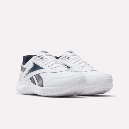 A pair of Reebok Men's Walk Ultra 7 DMX Max Wide 4E Shoes in white with navy accents and laces, featuring air cushioning, a chunky sole, and a sporty wide-fit design for extra comfort. Shown on a plain light background.