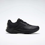 The Reebok Women's Walk Ultra 7 DMX Max Walking Shoes are black, low-profile sneakers with lace-up closure and minimalist design. Side view against a light gray background. Ideal for fans of Reebok walking shoes seeking comfort and style.
