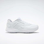 The Women's Walk Ultra 7 DMX Max Walking Shoes by Reebok, shown in side profile with sleek white design and subtle stitching against a plain background, feature DMX cushioning for all-day walking comfort.