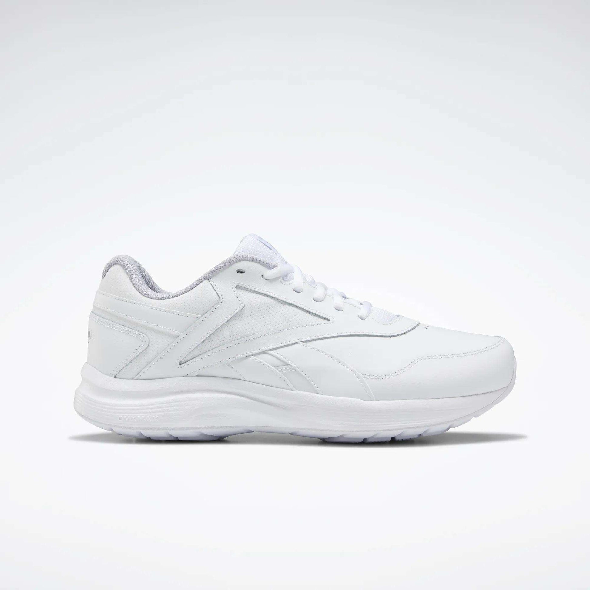 The Women's Walk Ultra 7 DMX Max Walking Shoes by Reebok, shown in side profile with sleek white design and subtle stitching against a plain background, feature DMX cushioning for all-day walking comfort.