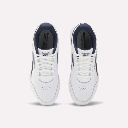 Top view of a pair of Reebok Walk Ultra 7 DMX Max walking shoes in white with navy blue accents, breathable mesh uppers, white laces, and the Reebok logo on the tongue and insole, placed side by side on a light background.