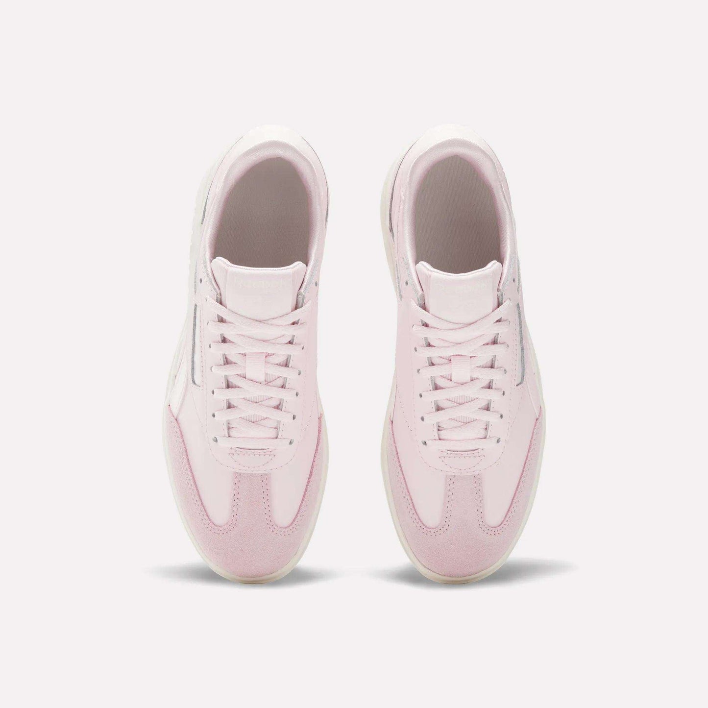 The Reebok Campio XT Double Shoes - Big Kids are stylish pink and white retro sneakers, perfect for girls.