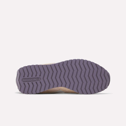 The image shows the sole of a Women's Classic AZ Shoe by Reebok, featuring a purple zigzag tread pattern and the Reebok logo on the left, echoing a retro running shoe vibe. The rest of the shoe is only partially visible.