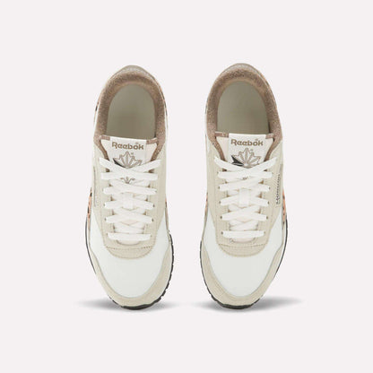 Top view of Reebok Women's Classic AZ Shoes with white laces, beige suede and white leather uppers, tan accents, and visible Reebok logos on the tongues, set against a plain white background for a retro vibe.